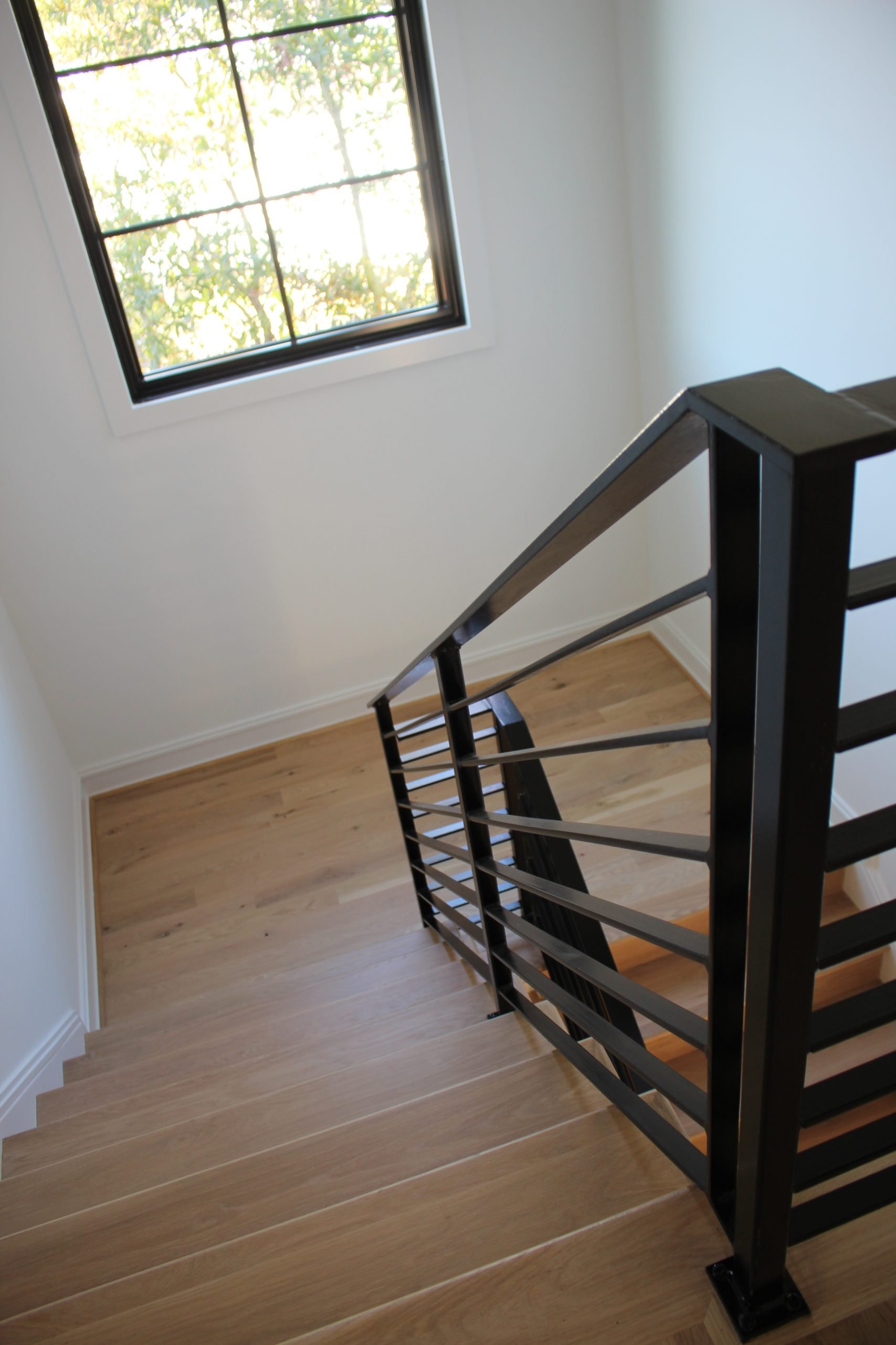This showcases a completed loudoun stairs project within a home in northern virginia. This showcases the rails that they handmade. 