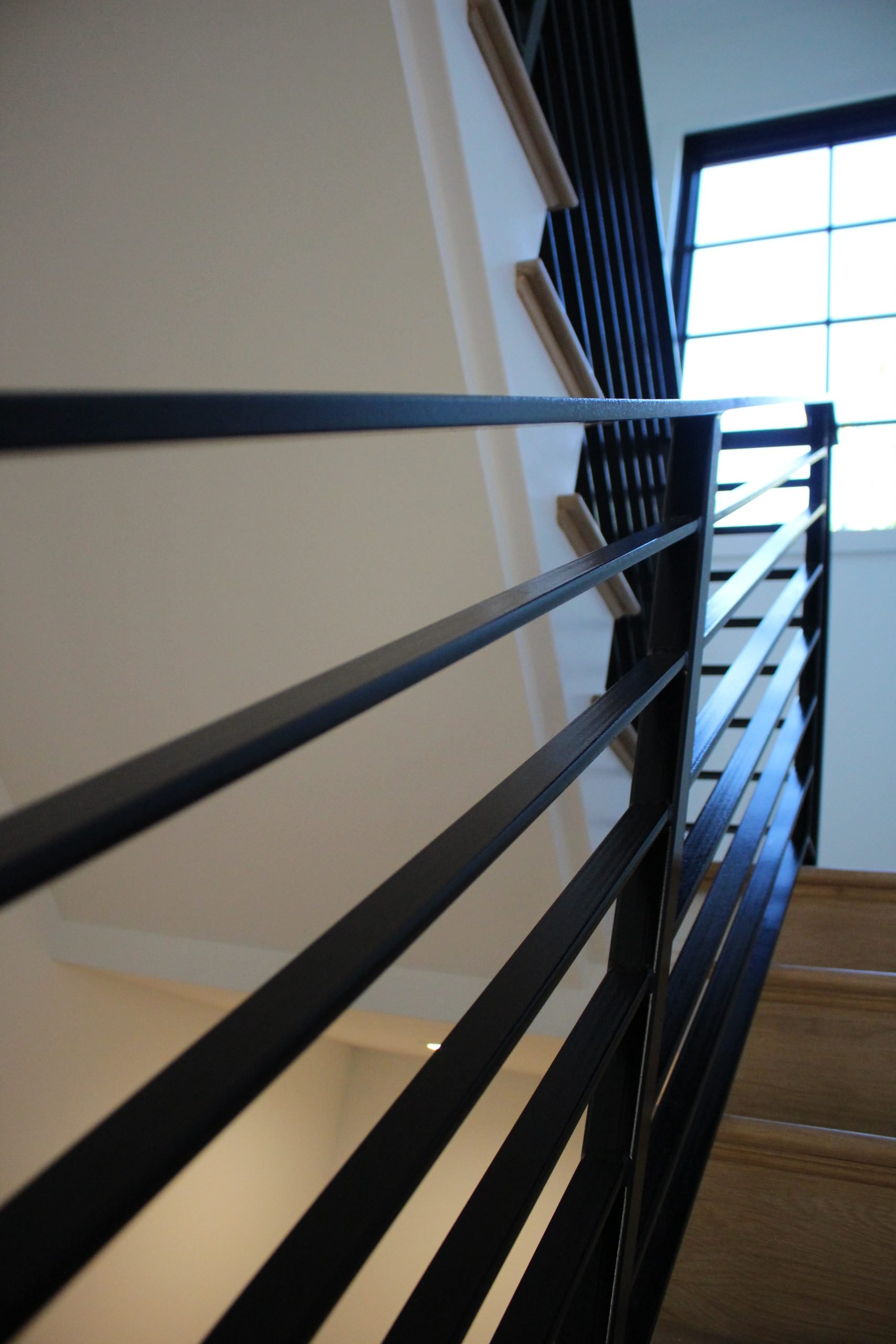 This showcases a completed loudoun stairs project within a home in northern virginia. This showcases the rails that they handmade. 