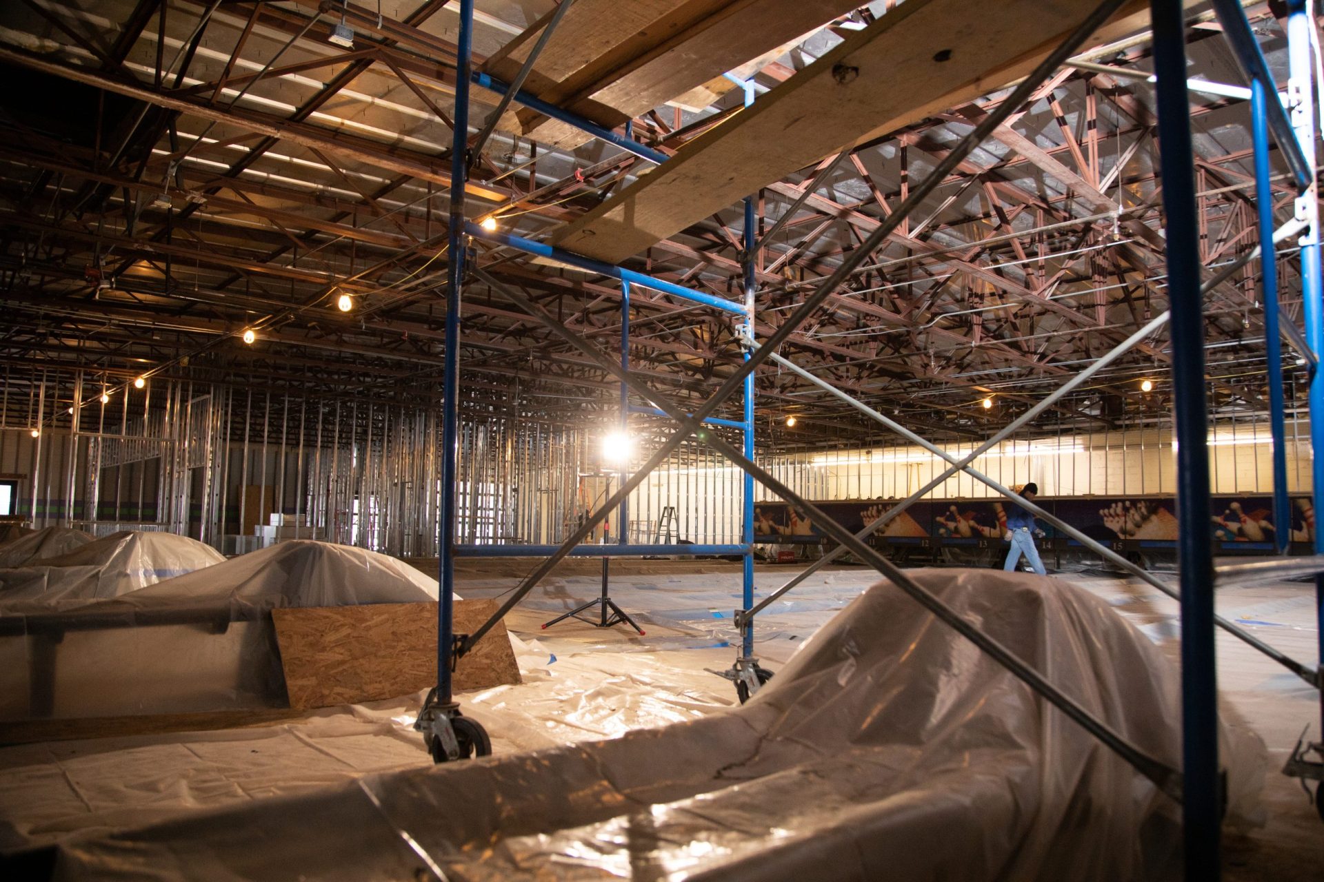 A bowling centre under construction, scoreboards and lane bays in place