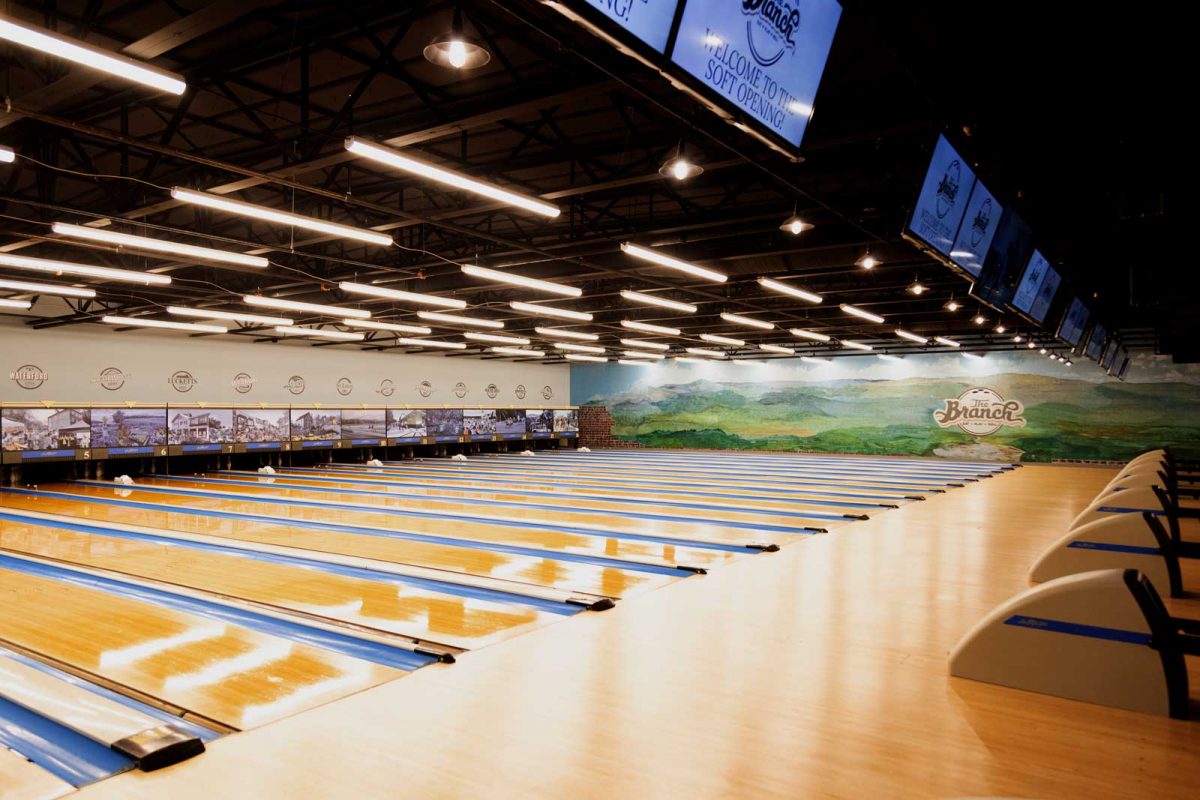 Finished bowling lanes with wall panels and mural